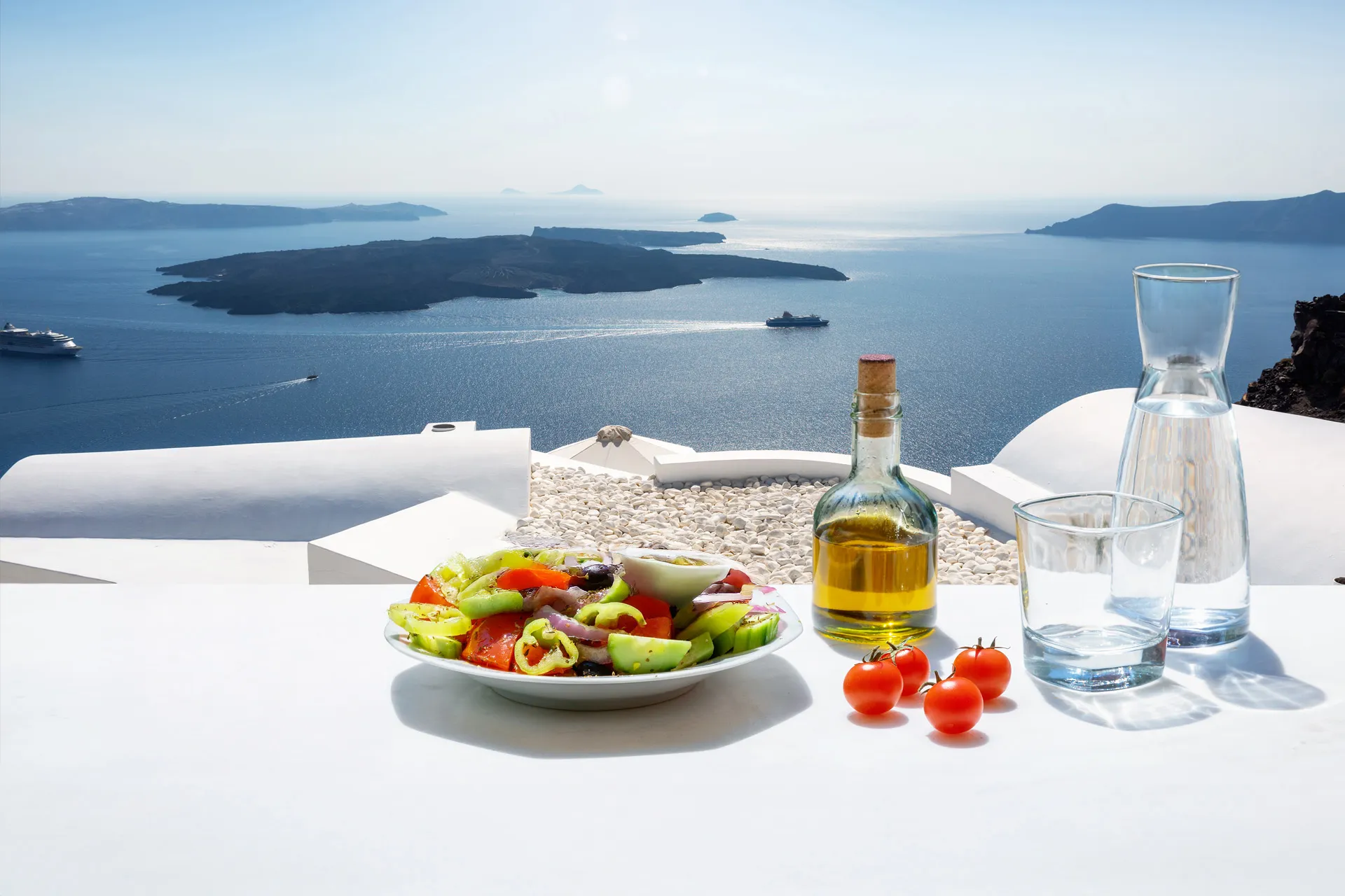 Greek salad on table with sea view